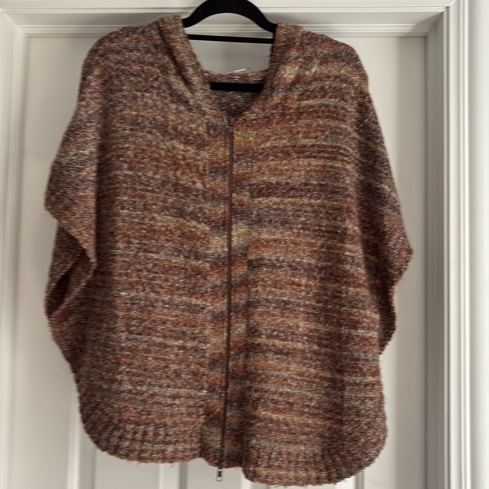 It’s a sweater- it’s a poncho- it’s both! Super soft and light weight. Layer me!